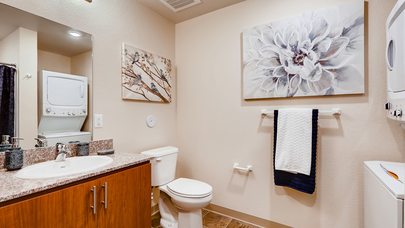 Holiday Westgate Village apartment bathroom with stackable washer and dryer
